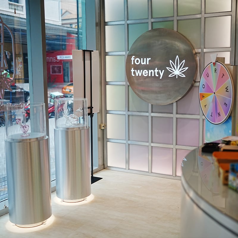 FOURTWENTY Thonglor interior with the circular logo and metal grid wall at the Major Tower branch.