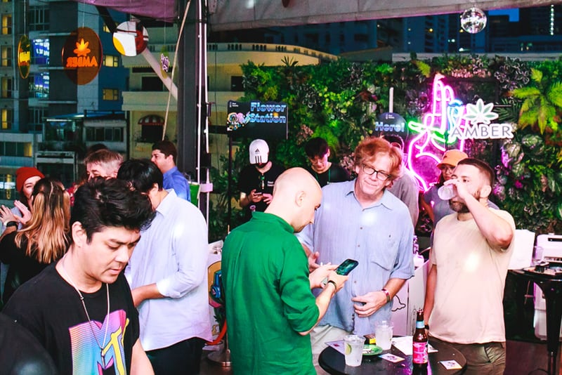 Crowd gathering at the High Garden rooftop event space.
