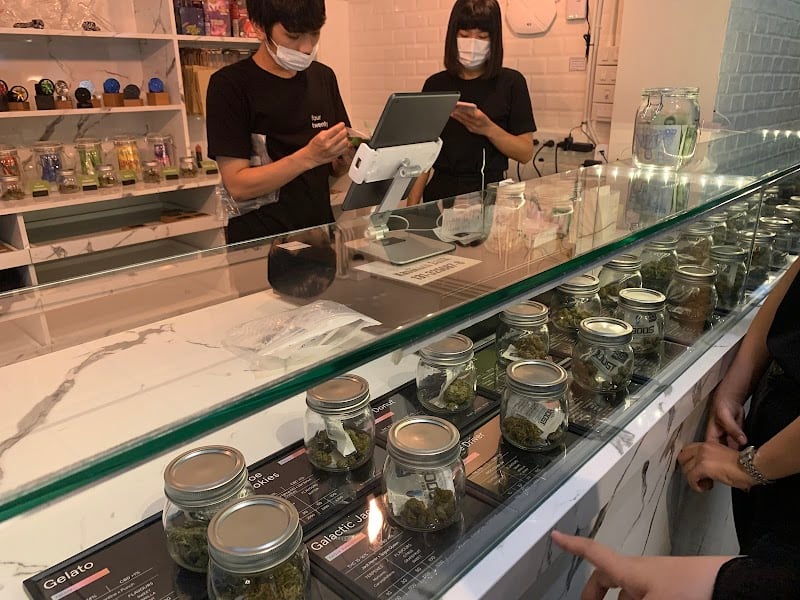 Display case and budtender counter inside the FOURTWENTY Asoke shop.